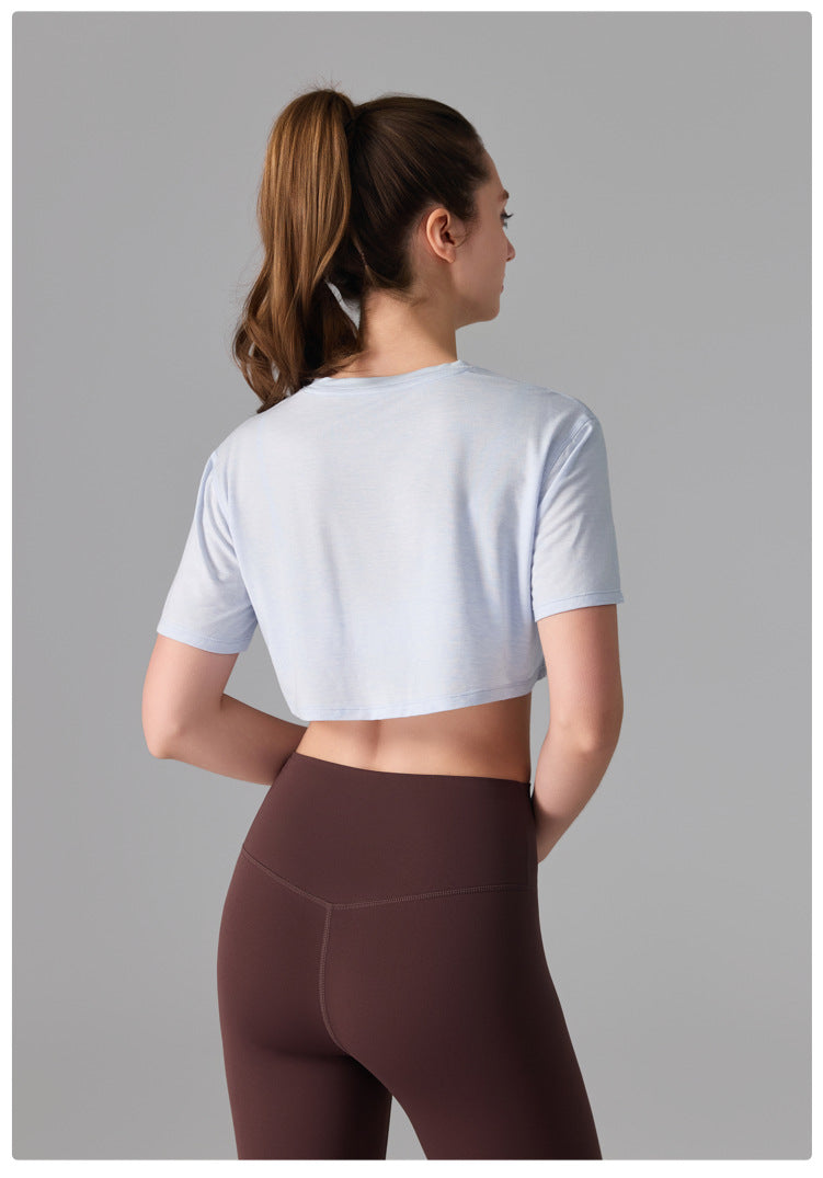 Camiseta deportiva de licra, estilo corto y holgado, transparente, de secado rápido y suave al tacto, ideal para fitness, running y yoga.