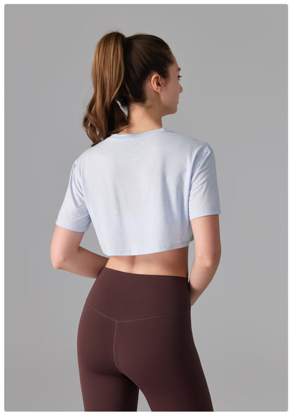 Camiseta deportiva de licra, estilo corto y holgado, transparente, de secado rápido y suave al tacto, ideal para fitness, running y yoga.